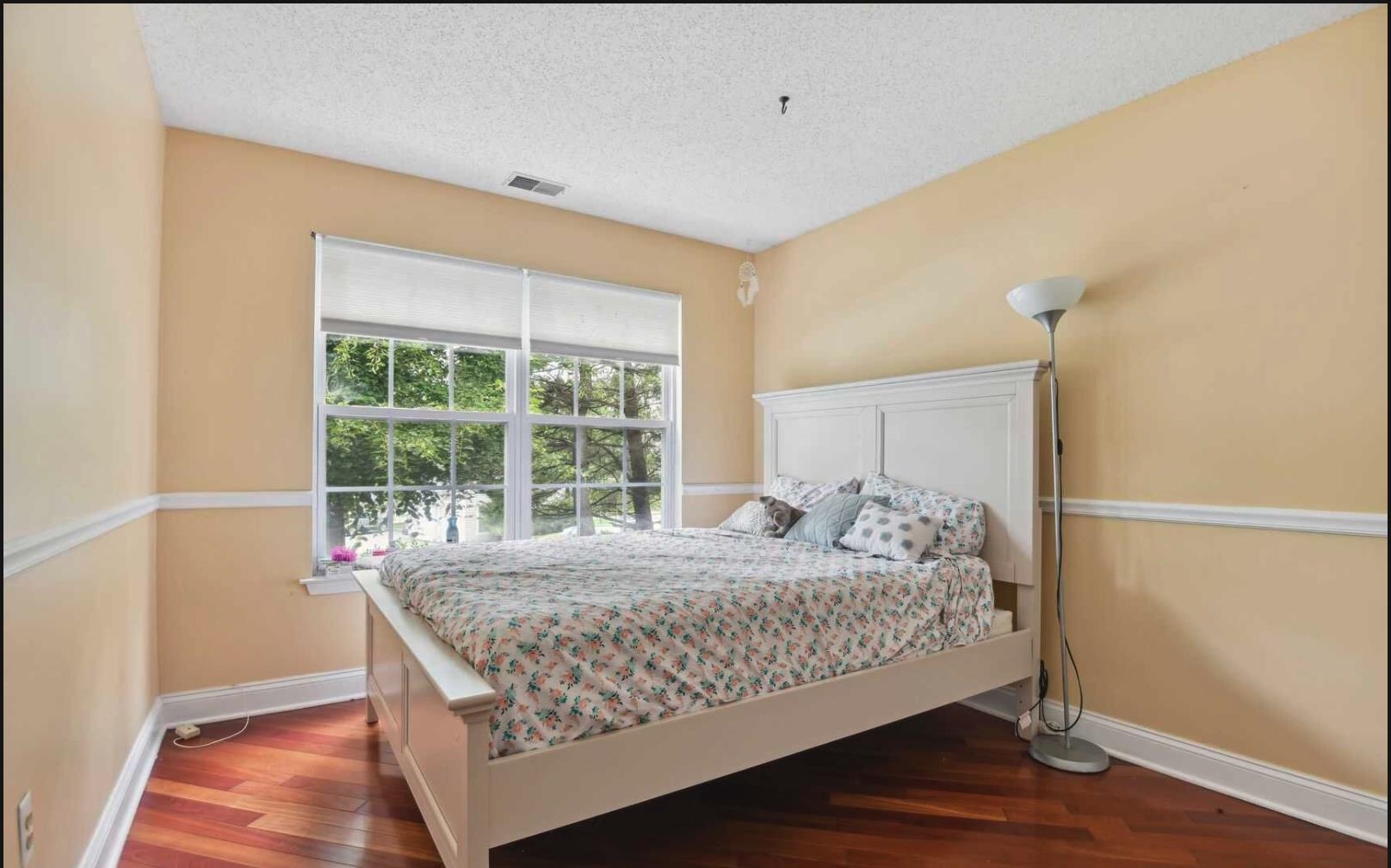 1272 Paddington Road Mahwah, NJ 07430 - Photo 7 of 15 a bedroom with a bed and wooden floor