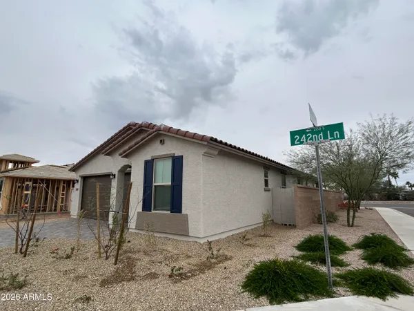 a view of a house with a yard and plants