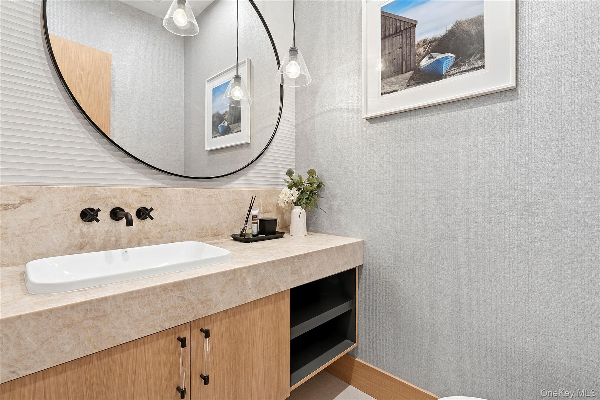 35 Springwood Way East Hampton, NY 11937 - Photo 11 of 26 a bathroom with a sink and a mirror