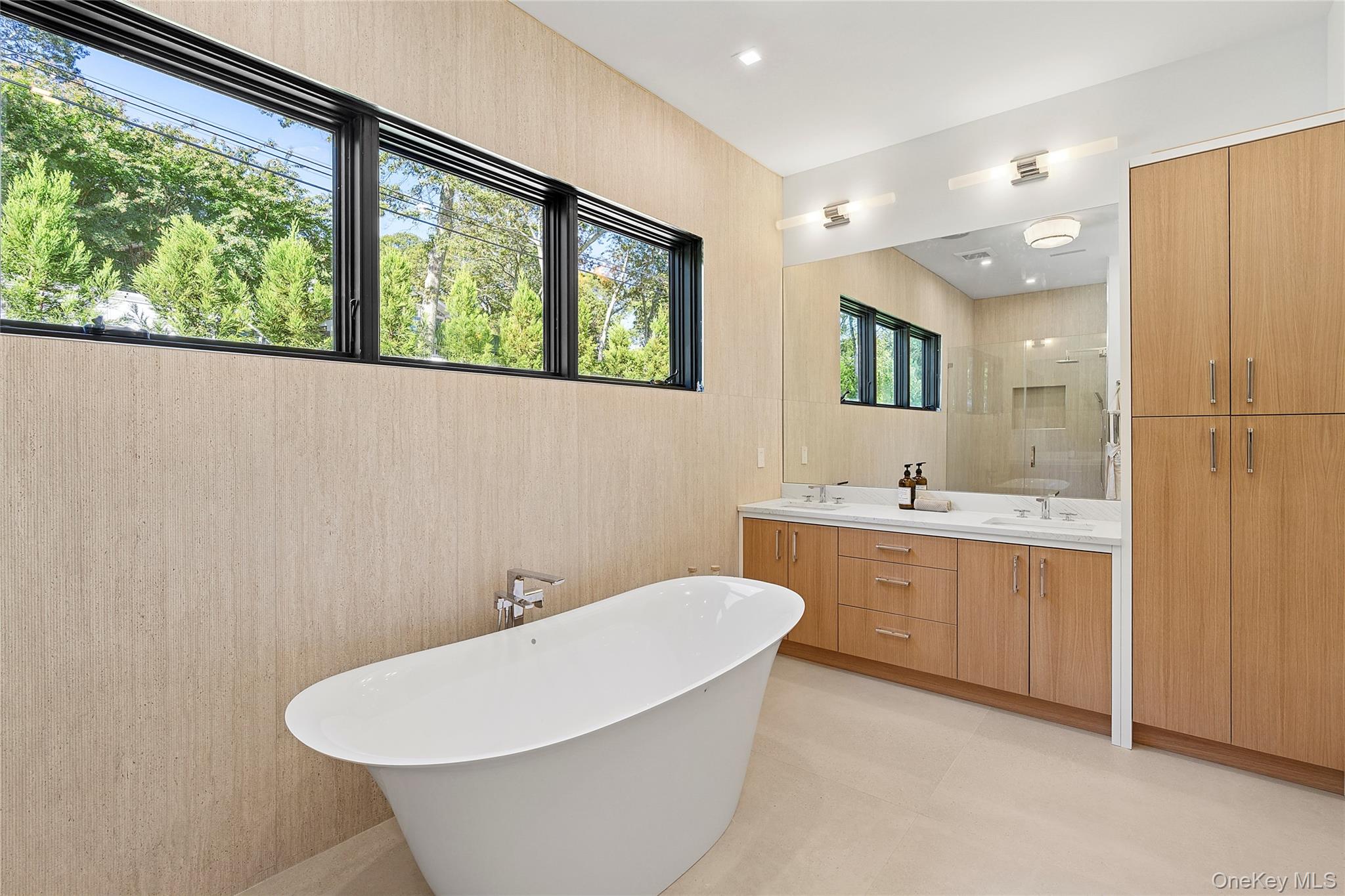 35 Springwood Way East Hampton, NY 11937 - Photo 14 of 38 a bathroom with a sink and mirror