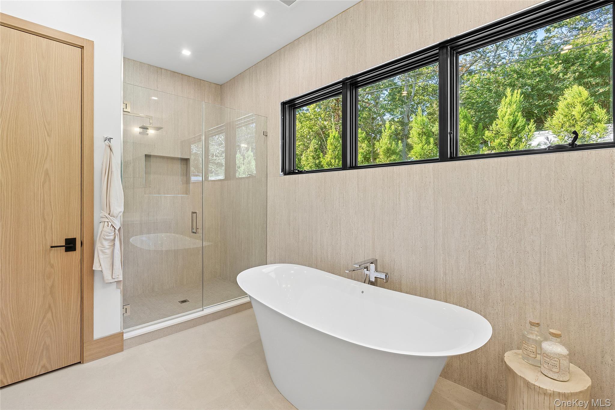 35 Springwood Way East Hampton, NY 11937 - Photo 15 of 38 a bathroom with a bathtub and a shower