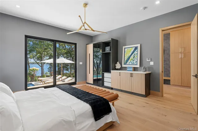 a bedroom with a large bed and a large window