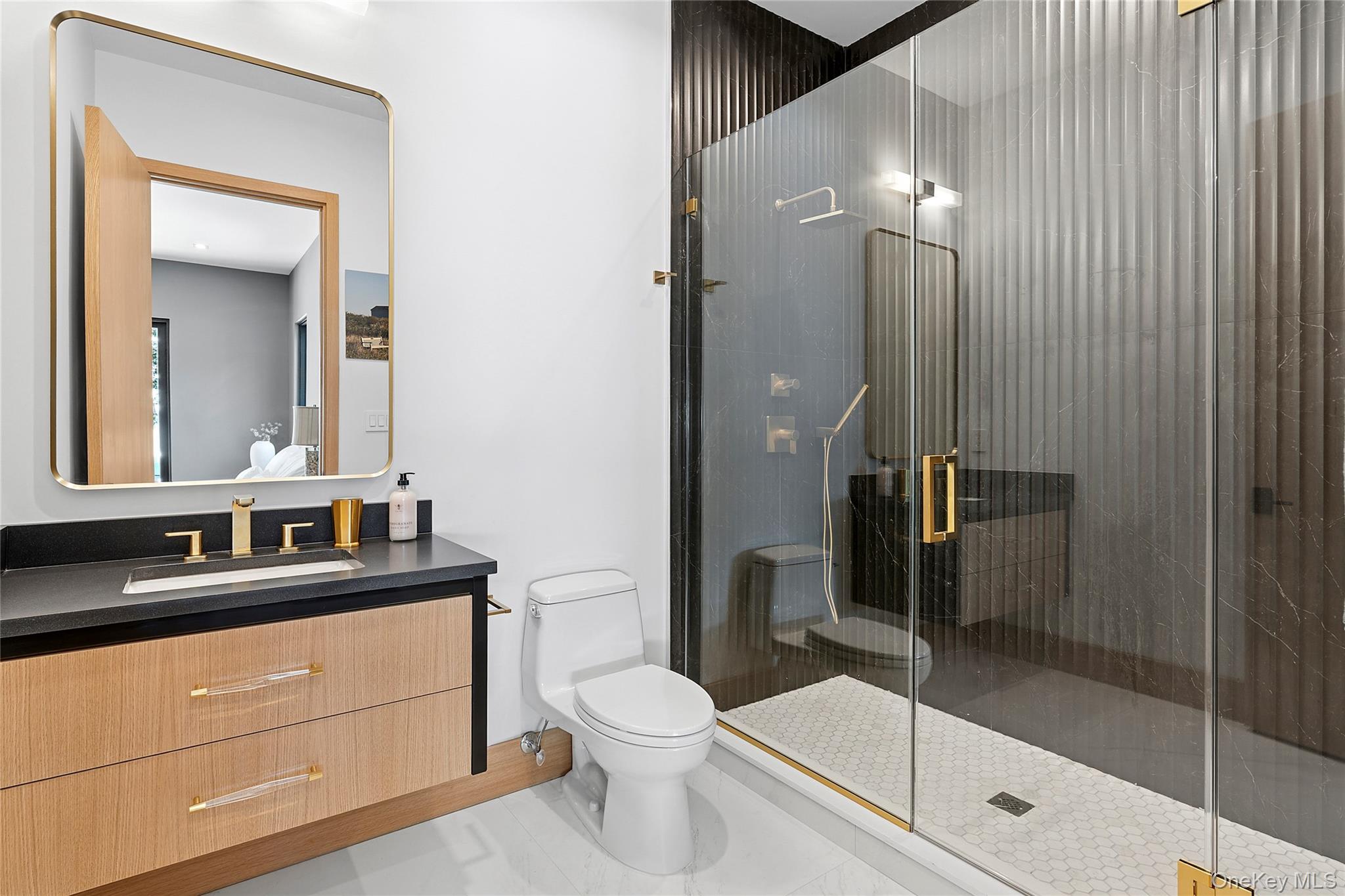35 Springwood Way East Hampton, NY 11937 - Photo 17 of 26 a bathroom with a toilet a sink and shower