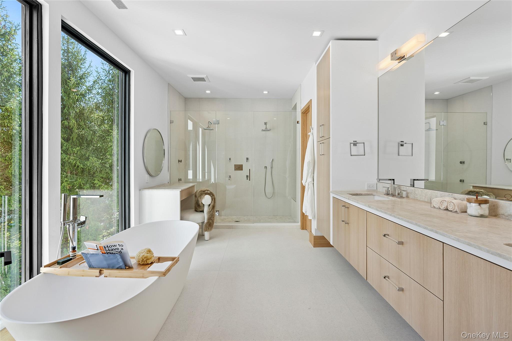 35 Springwood Way East Hampton, NY 11937 - Photo 21 of 26 a spacious bathroom with a double vanity sink a mirror and a shower