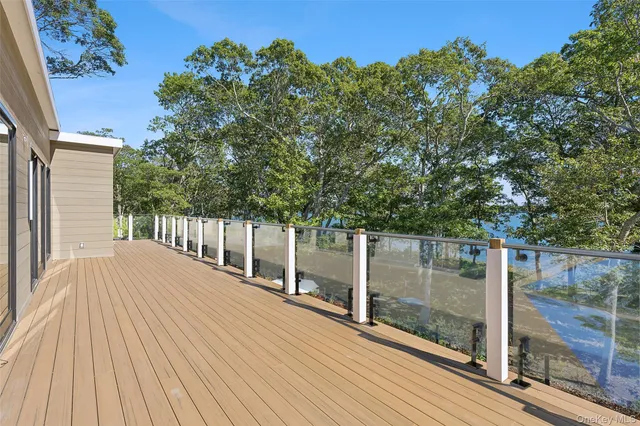 a balcony with view of trees in front of it