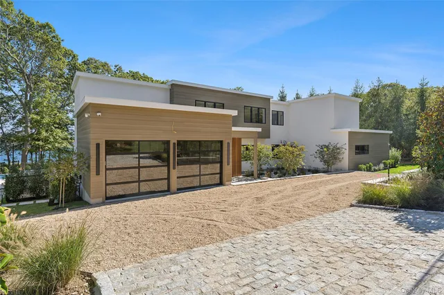 a view of a house with a yard and garage
