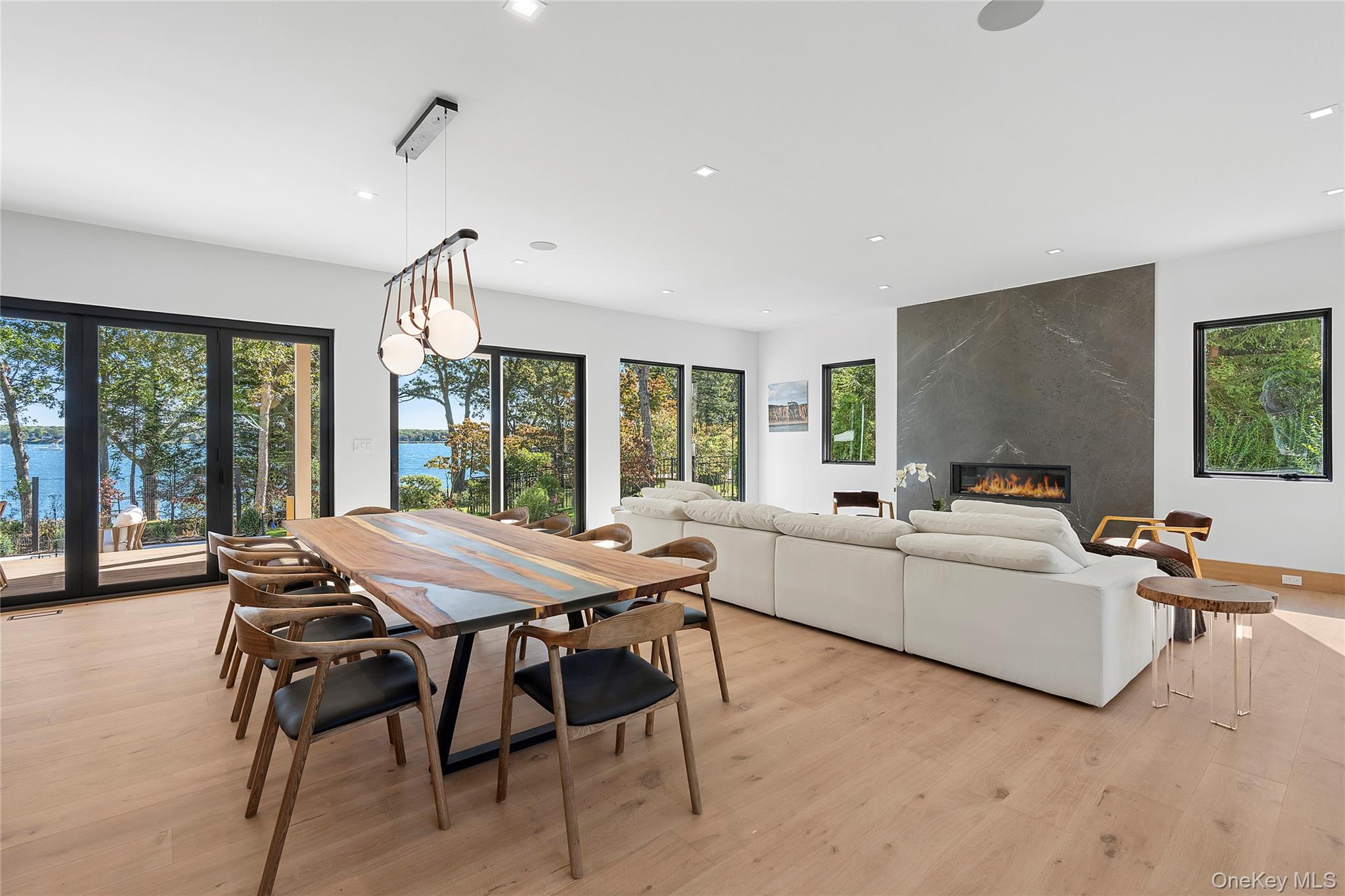 35 Springwood Way East Hampton, NY 11937 - Photo 5 of 38 a living room with furniture a table and chairs