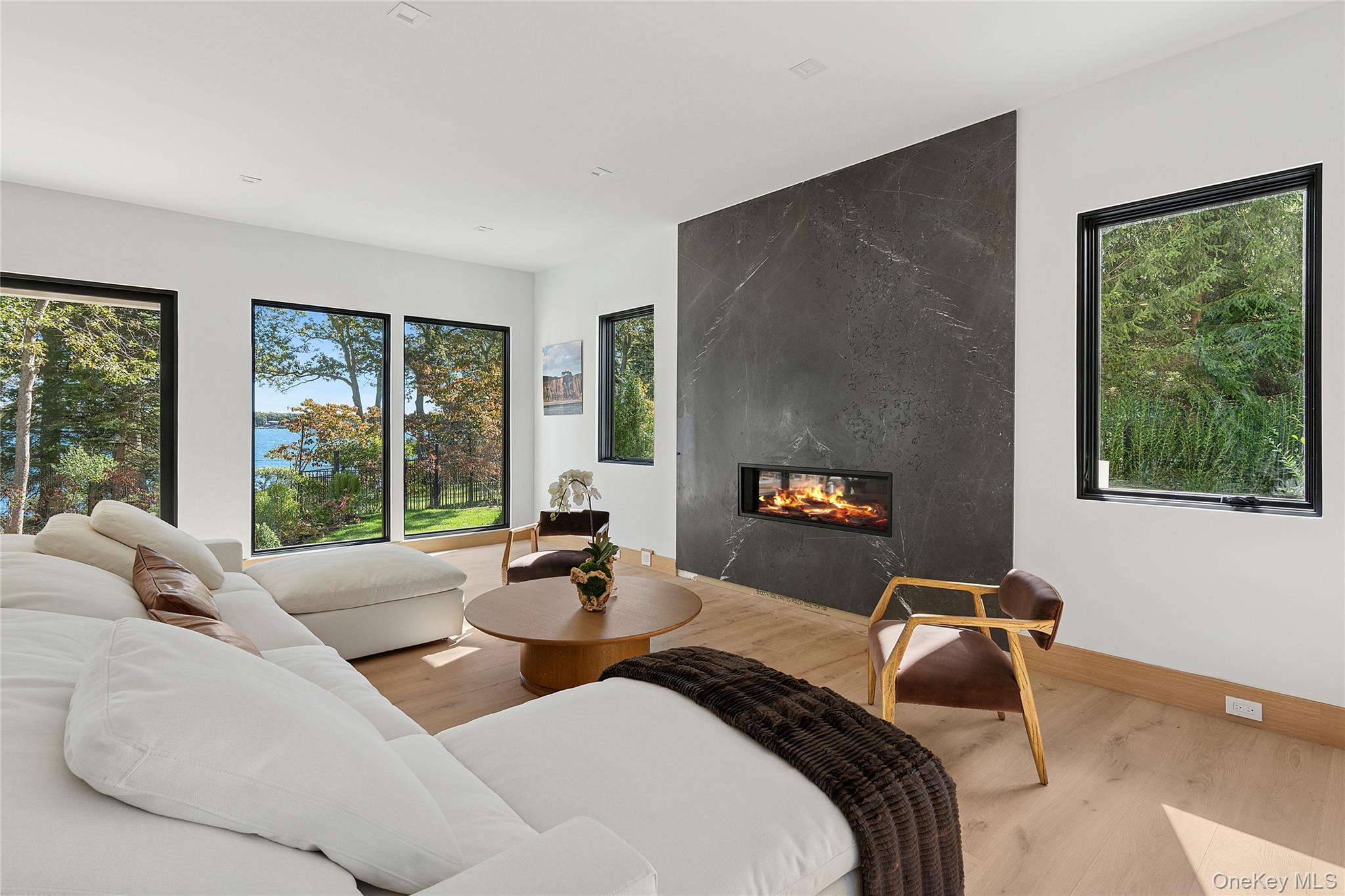 35 Springwood Way East Hampton, NY 11937 - Photo 5 of 26 a bedroom with a bed and a large window