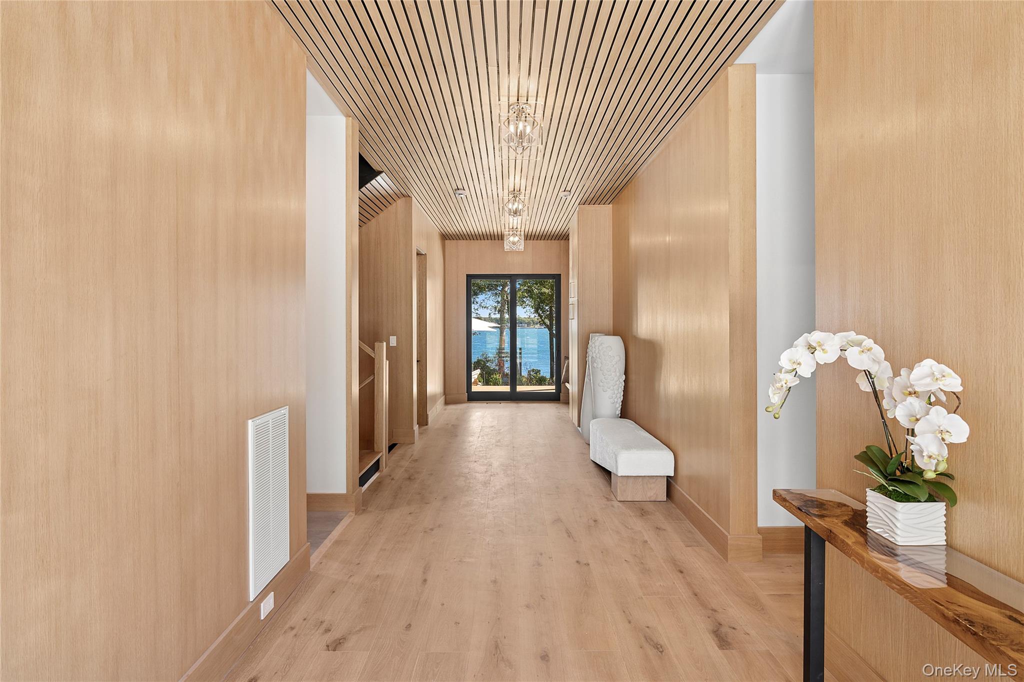 35 Springwood Way East Hampton, NY 11937 - Photo 9 of 26 a view of a hallway with wooden floor