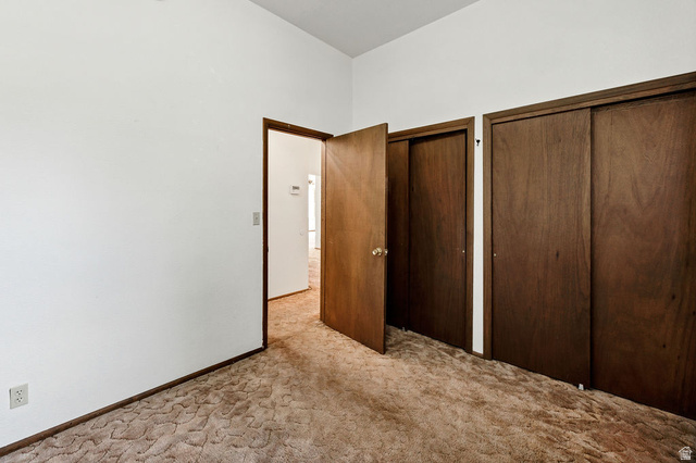 299 West Center Street, Unit 2 Logan, UT 84321 - Photo 23 of 46 Neutral wall finishes with a textured carpet floor