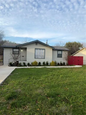 a front view of house with yard and outdoor seating