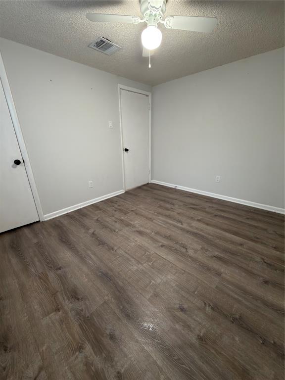 2426 May Lane Grand Prairie, TX 75050 - Photo 12 of 20 a view of an empty room with wooden floor