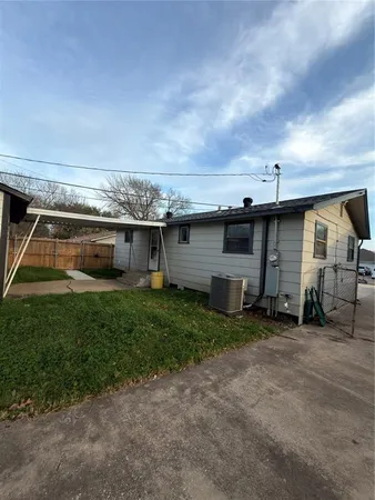 a view of a backyard of the house