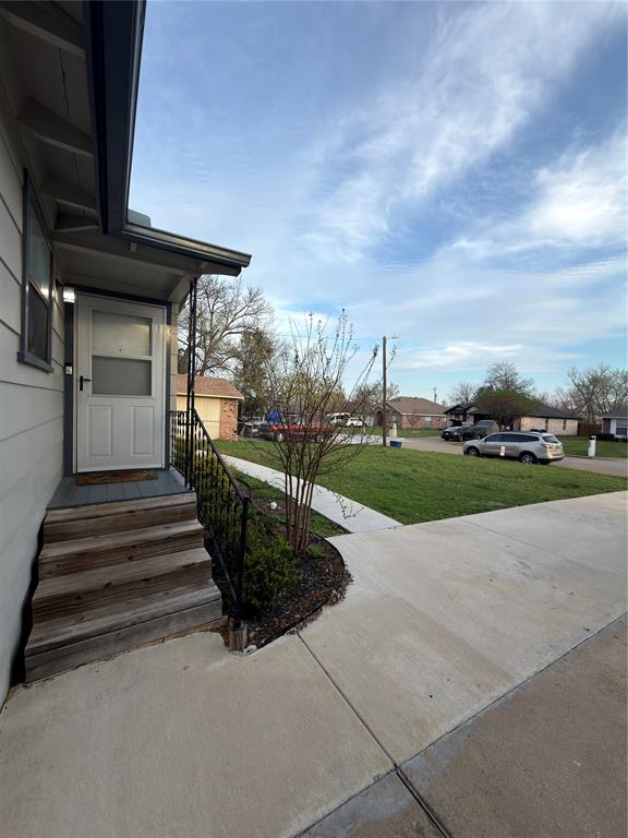 2426 May Lane Grand Prairie, TX 75050 - Photo 20 of 20 a view of a house with a yard