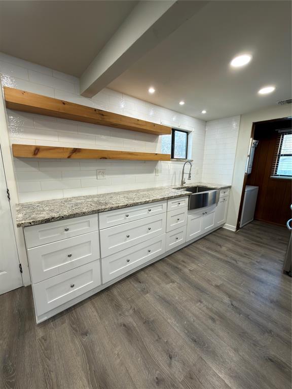 2426 May Lane Grand Prairie, TX 75050 - Photo 2 of 20 a kitchen with granite countertop white cabinets and stainless steel appliances