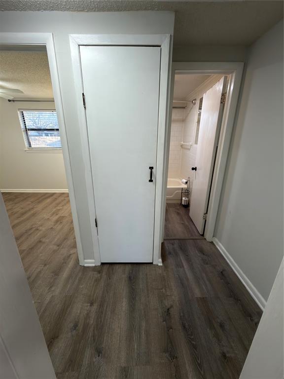 2426 May Lane Grand Prairie, TX 75050 - Photo 8 of 20 a view of a hallway with wooden floor and a hallway