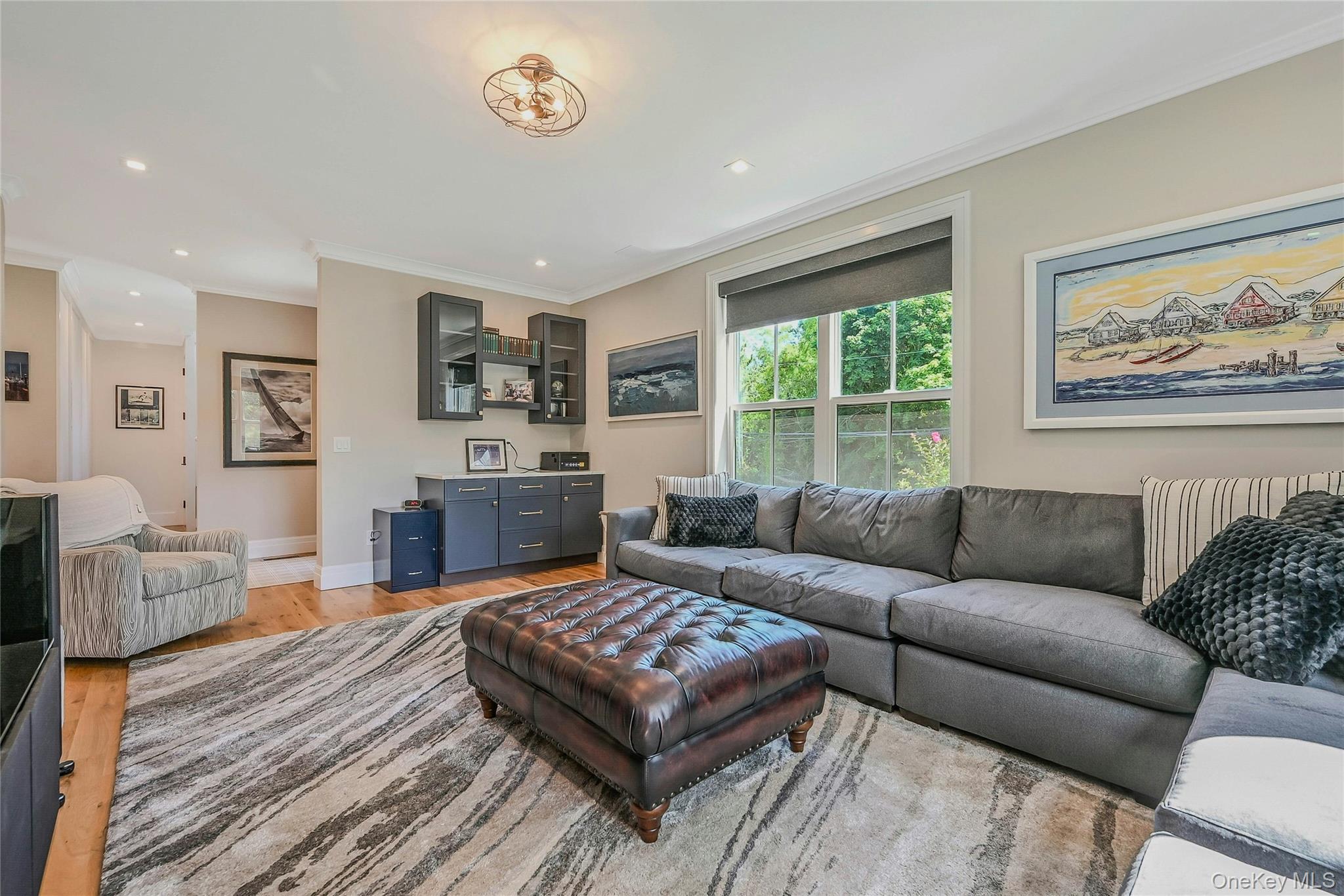 1665 Glenn Road Southold, NY 11971 - Photo 11 of 34 a living room with furniture fireplace and window