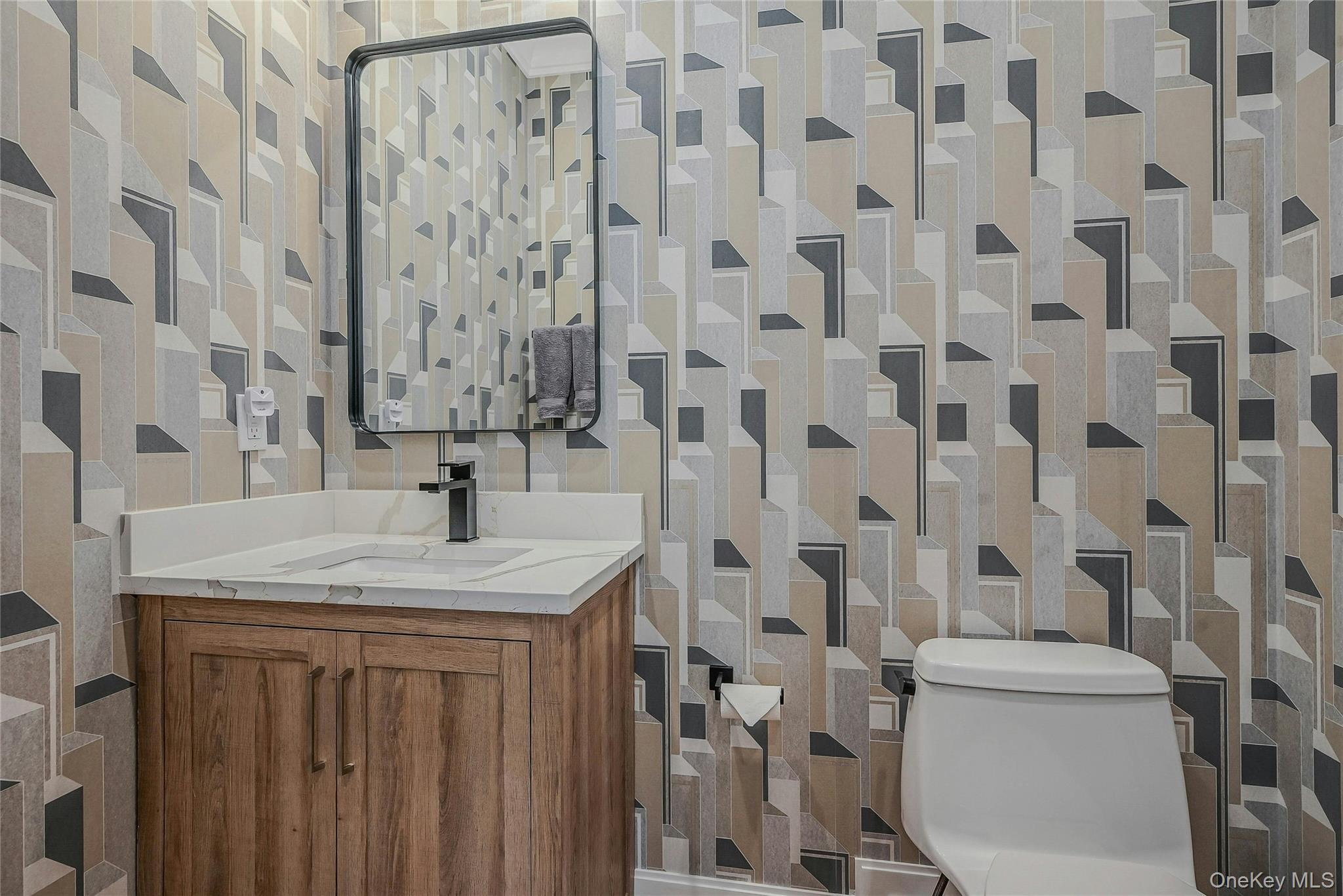 1665 Glenn Road Southold, NY 11971 - Photo 16 of 34 a bathroom with a granite countertop sink a toilet and shower
