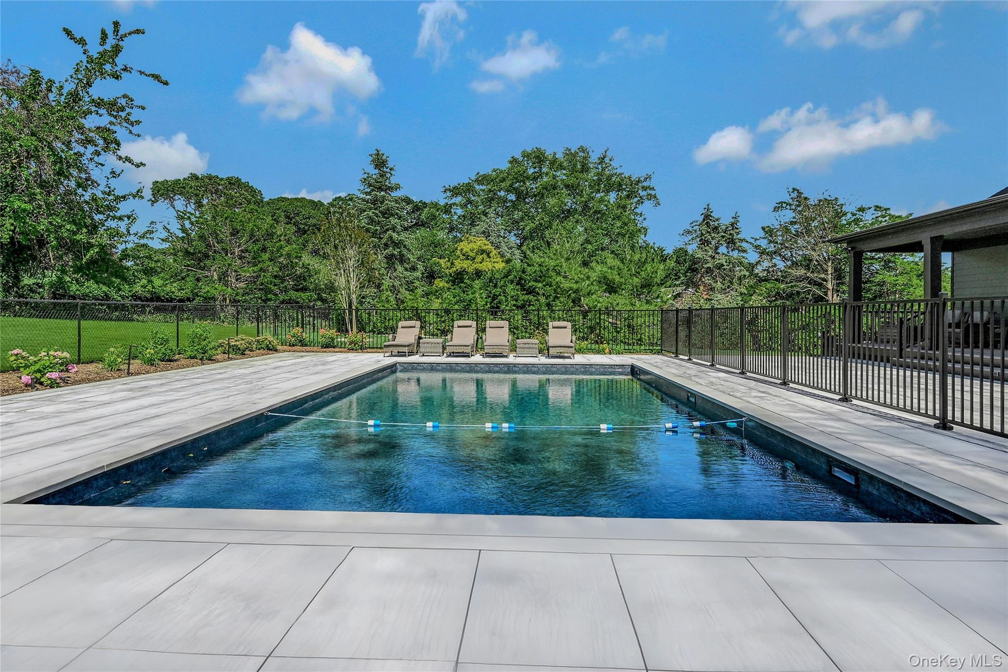 1665 Glenn Road Southold, NY 11971 - Photo 2 of 34 a view of a swimming pool with a yard