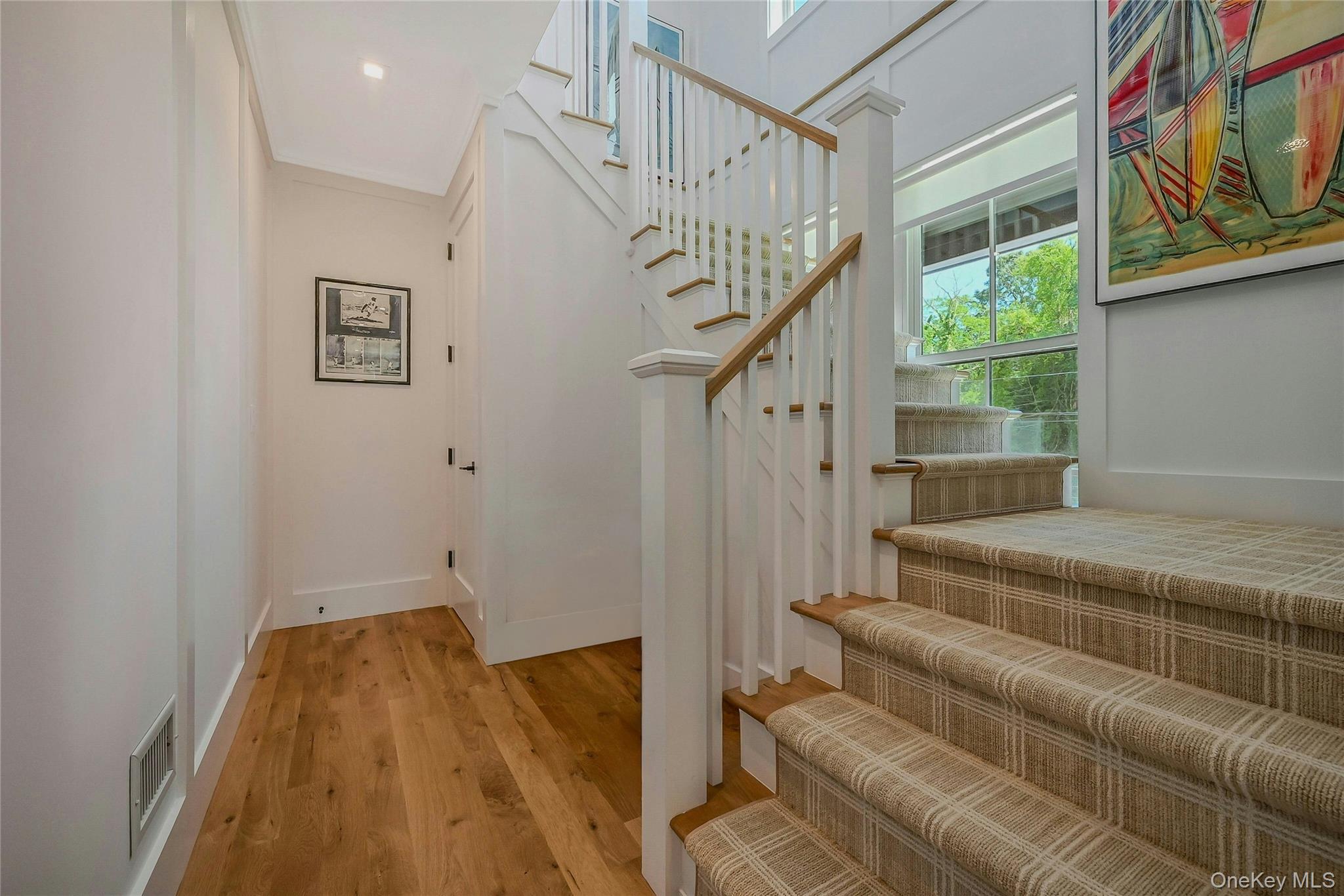 1665 Glenn Road Southold, NY 11971 - Photo 19 of 34 a view of entryway and hall with wooden floor