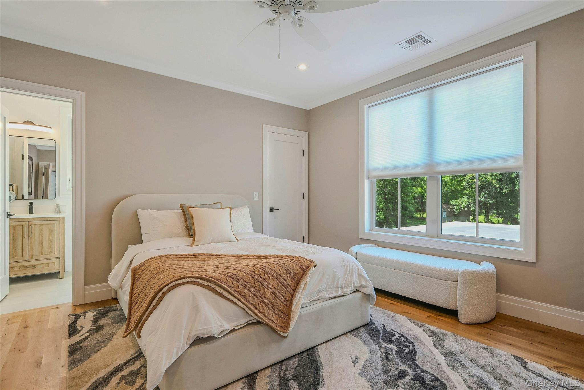 1665 Glenn Road Southold, NY 11971 - Photo 20 of 34 a bedroom with a bed and a window