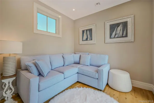 a bathroom with a toilet a sink a vanity and mirror