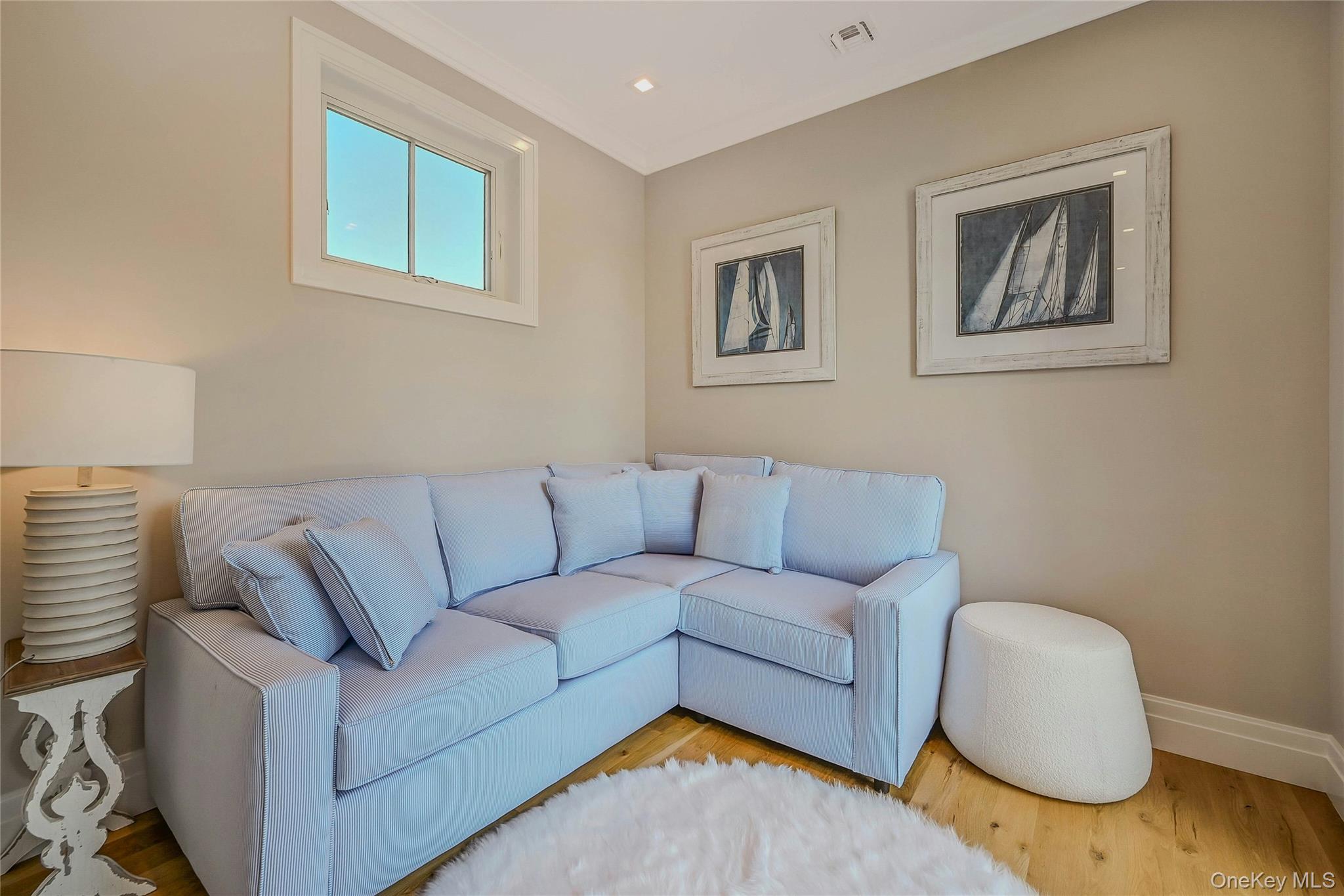 1665 Glenn Road Southold, NY 11971 - Photo 27 of 34 a living room with furniture and a wooden floor