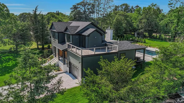a view of a deck with a floor to ceiling window with wooden floor