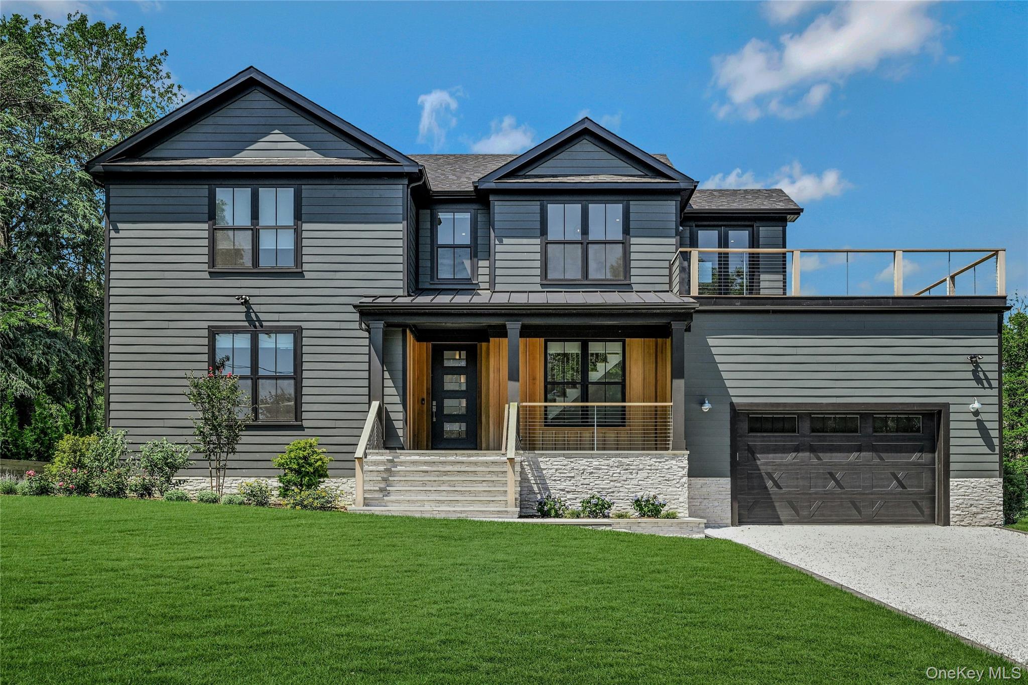 1665 Glenn Road Southold, NY 11971 - Photo 4 of 34 a front view of a house with a yard