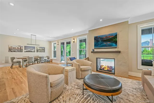 a living room with fireplace furniture and a fireplace