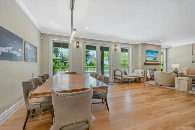 a living room with furniture and large windows