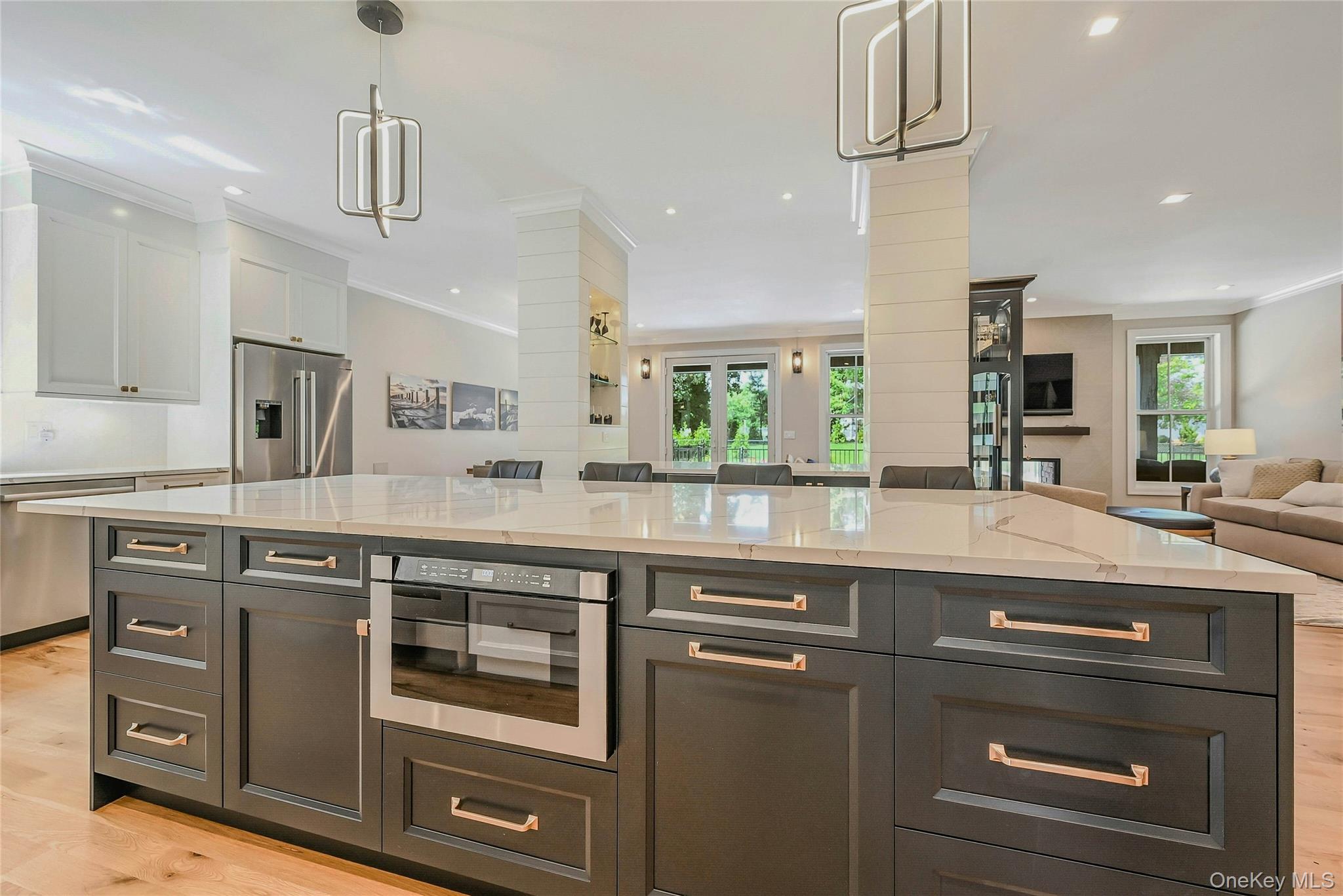 1665 Glenn Road Southold, NY 11971 - Photo 33 of 34 a kitchen with stainless steel appliances granite countertop a sink and a refrigerator