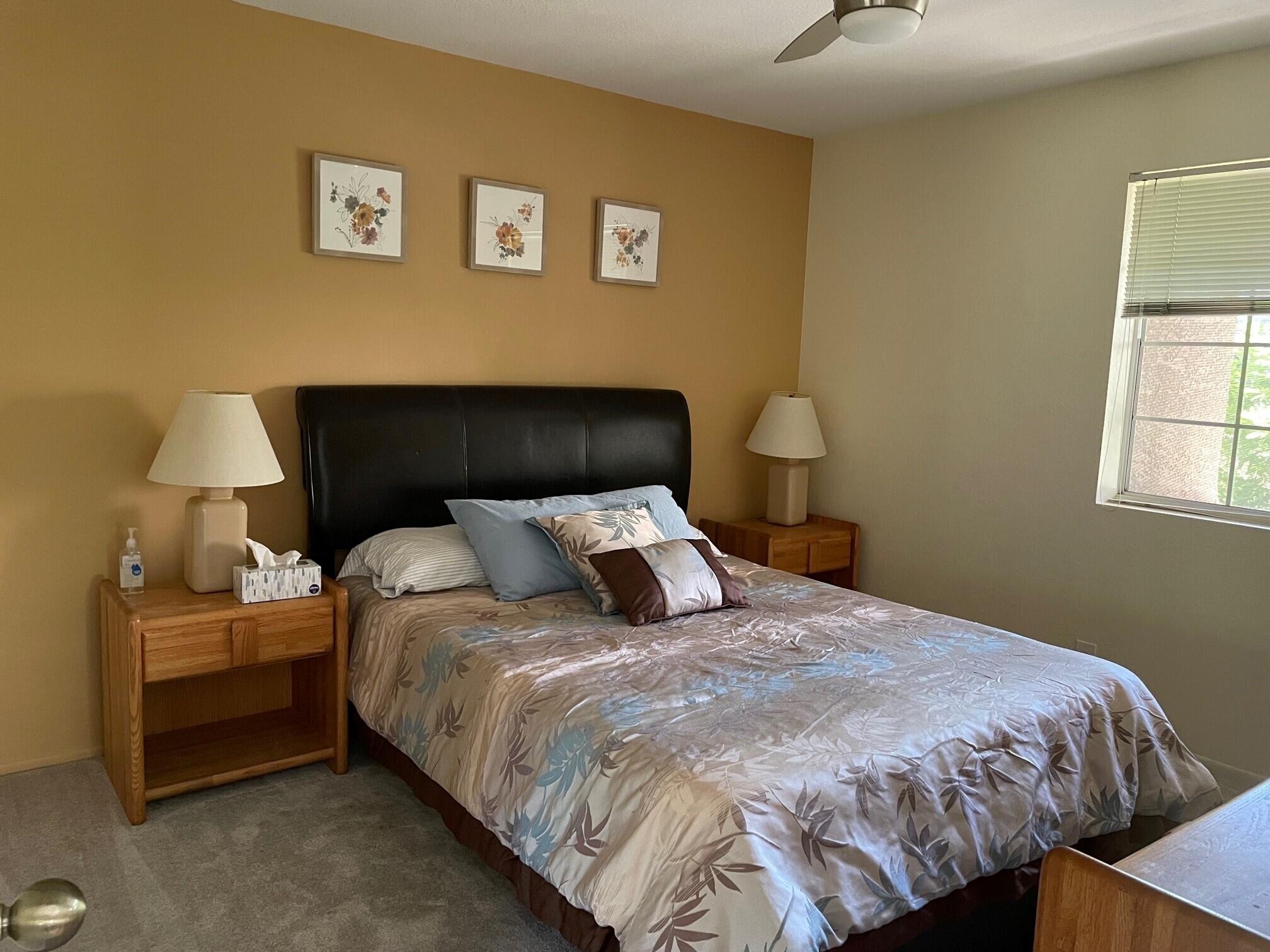 2700 Lawrence Crossley Road, Unit 51 Palm Springs, CA 92264 - Photo 11 of 23 a bedroom with a bed and window
