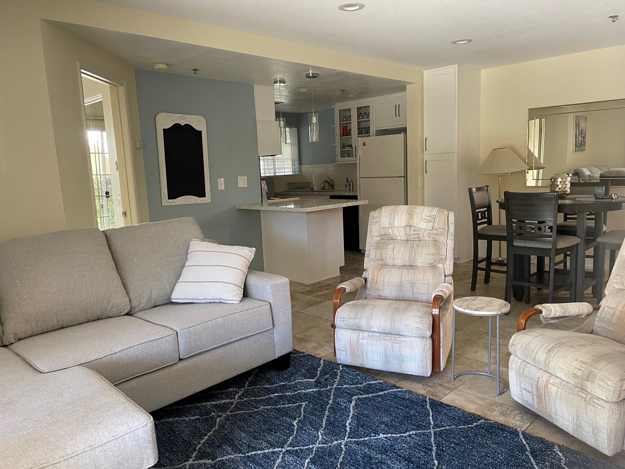 2700 Lawrence Crossley Road, Unit 51 Palm Springs, CA 92264 - Photo 2 of 23 a living room with furniture and kitchen view