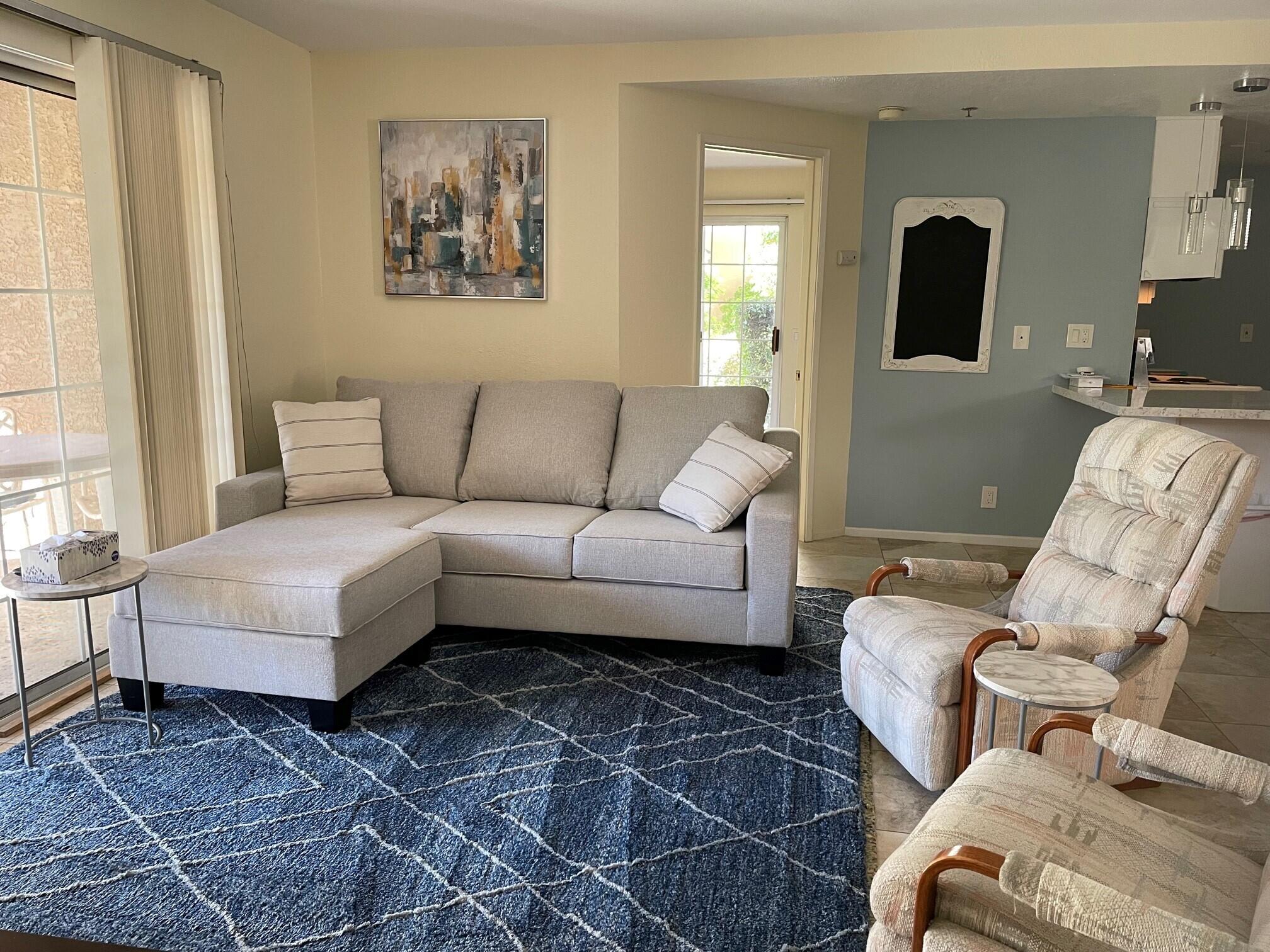 2700 Lawrence Crossley Road, Unit 51 Palm Springs, CA 92264 - Photo 5 of 23 a living room with furniture and a window