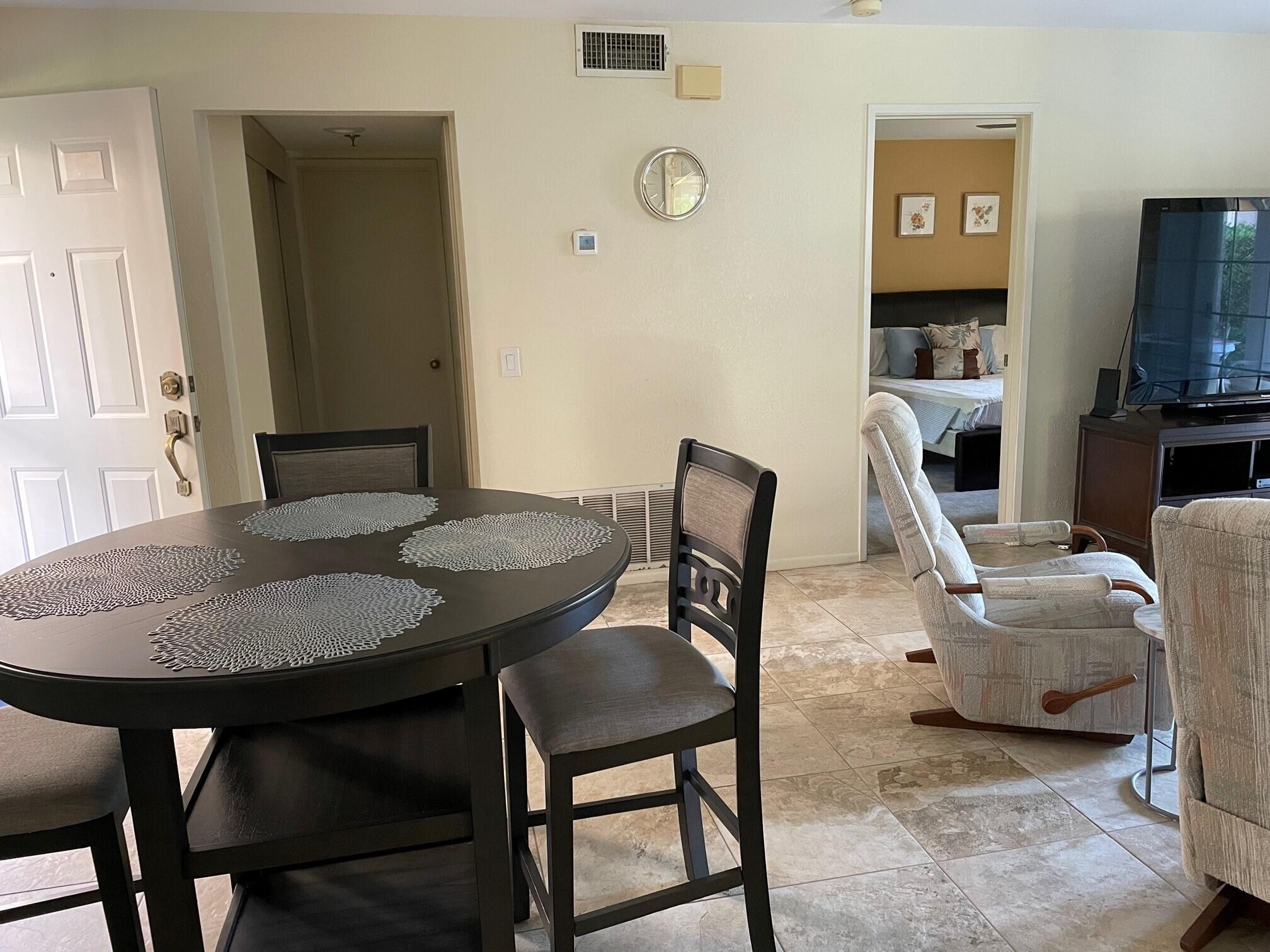 2700 Lawrence Crossley Road, Unit 51 Palm Springs, CA 92264 - Photo 6 of 23 a view of a dining room with furniture