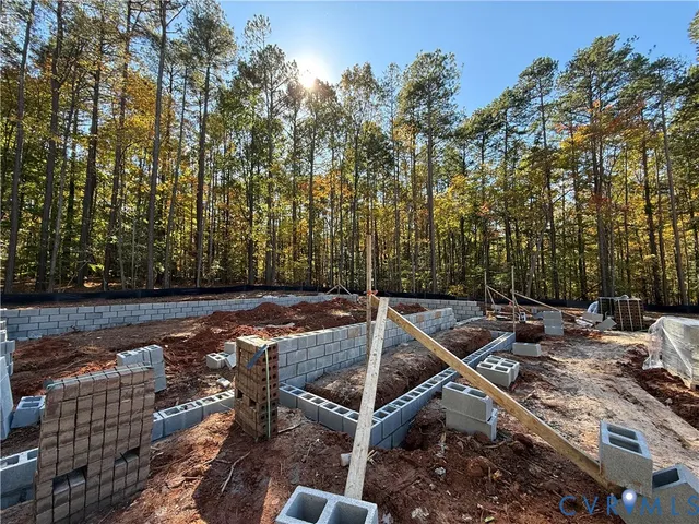 a bedroom with a bed and a potted plant