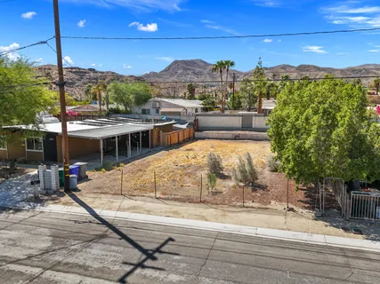 a view of a swimming pool with a lake view
