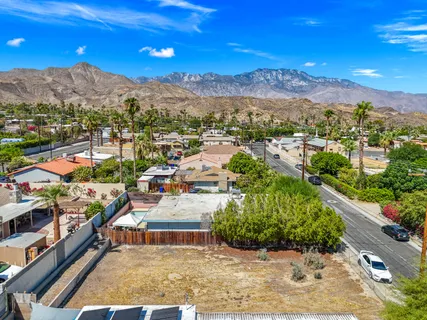 a view of a city with mountains in the background