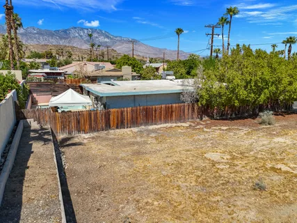 a view of a backyard with sitting area