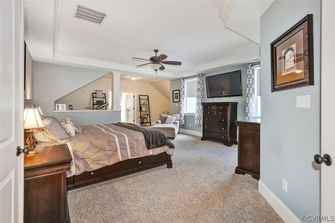 15930 Alsdell Road Midlothian, VA 23112 - Photo 33 of 50 a spacious bedroom with a bed and a flat screen tv