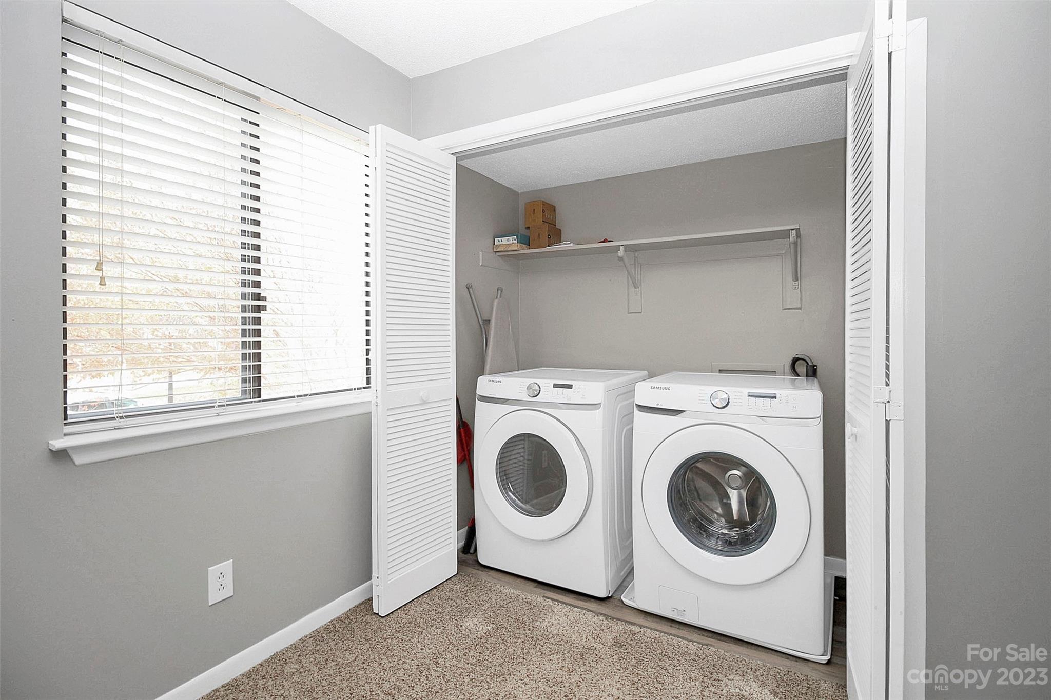 6144 Heath Ridge Court, Unit C Charlotte, NC 28210 - Photo 14 of 36 a utility room with dryer and washer