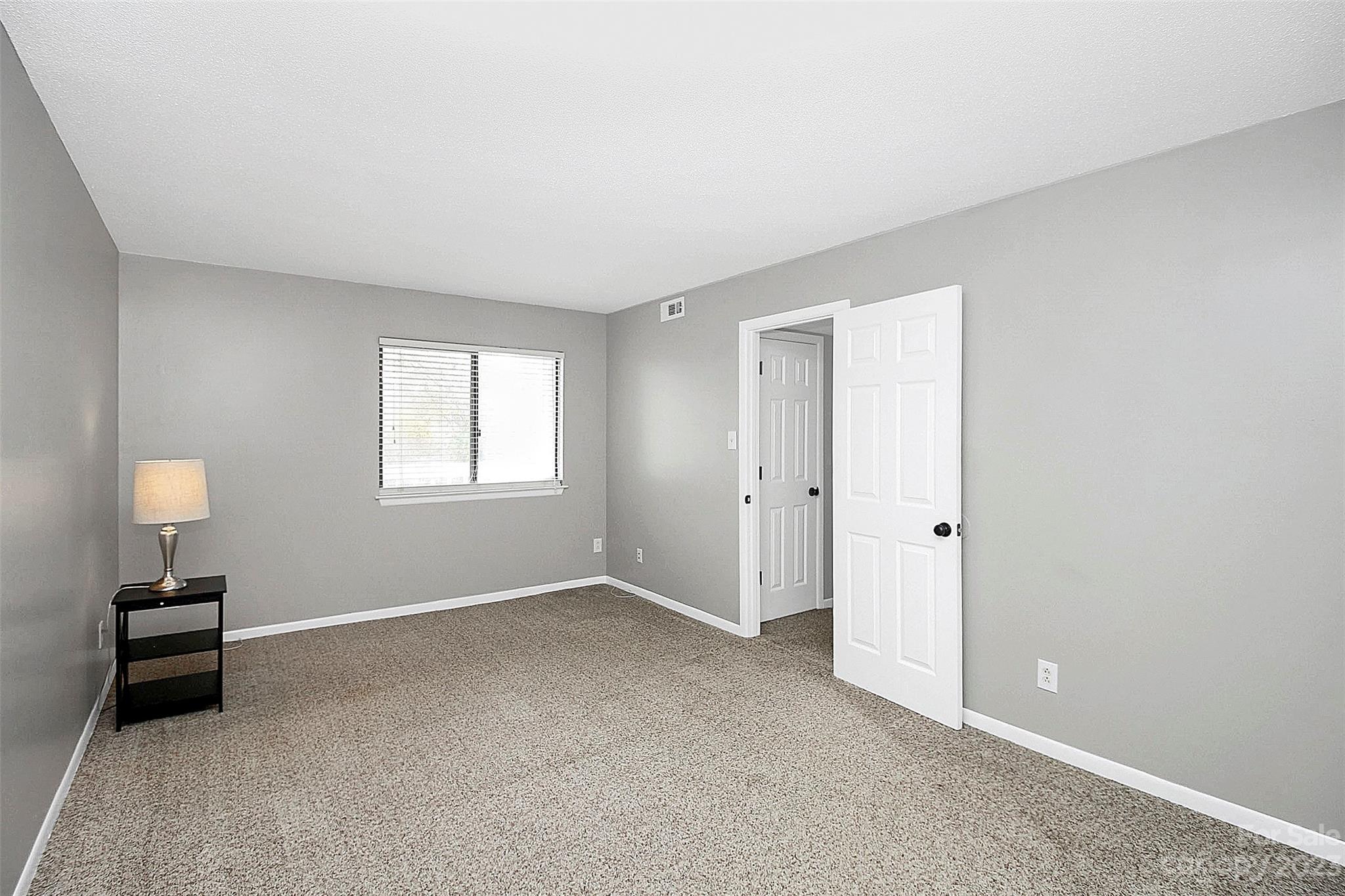 6144 Heath Ridge Court, Unit C Charlotte, NC 28210 - Photo 30 of 36 a view of a room with a window