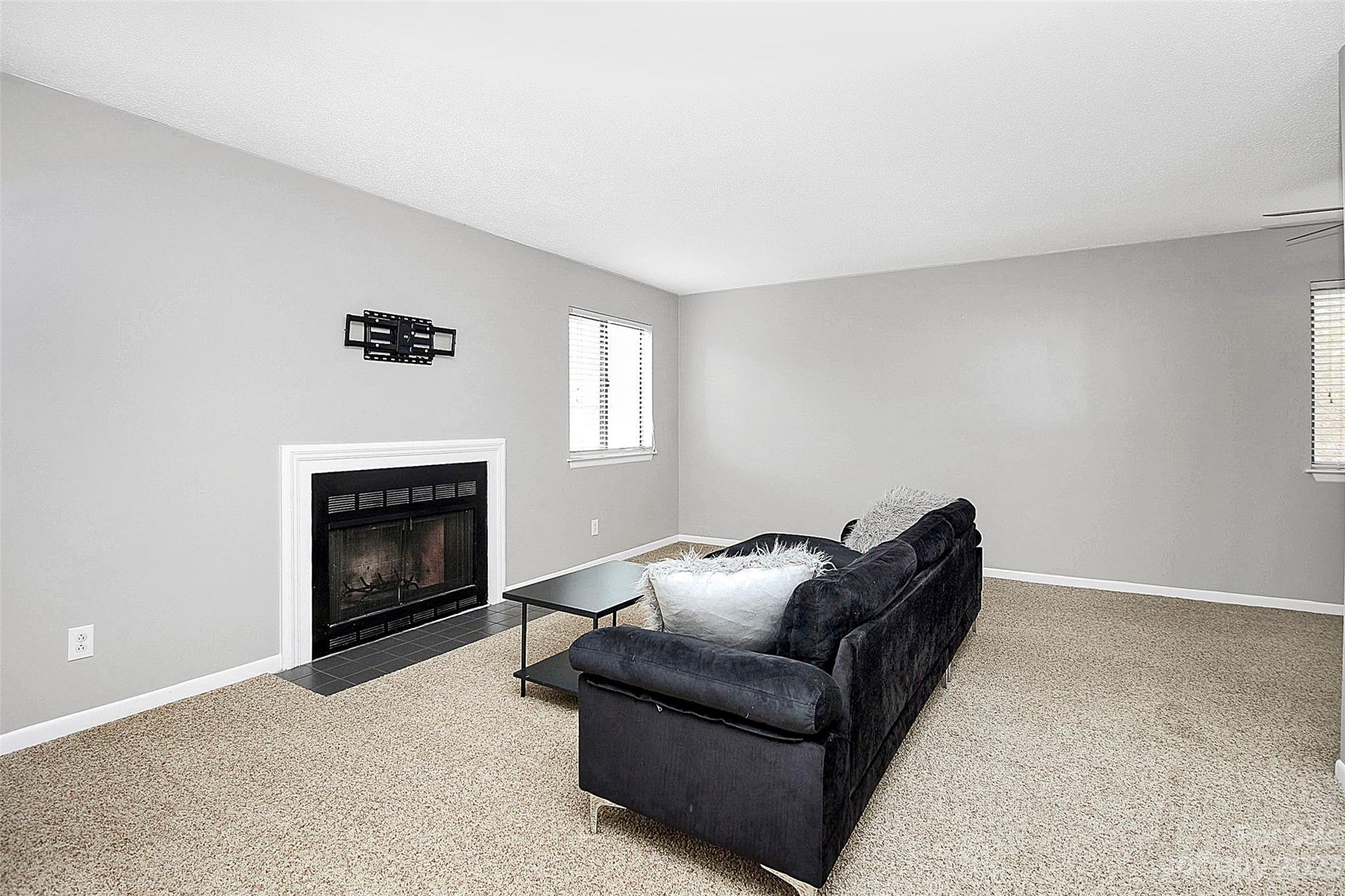 6144 Heath Ridge Court, Unit C Charlotte, NC 28210 - Photo 9 of 36 a living room with furniture and a fireplace