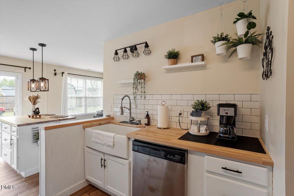 205 Battery Way Bunnlevel, NC 28323 - Photo 16 of 37 a kitchen with a sink and cabinets