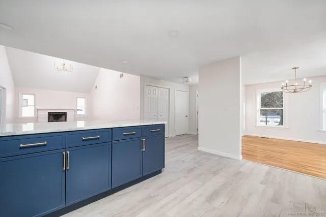 a room with a dresser and a window