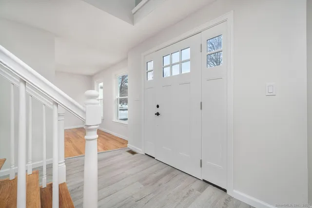 a view of entryway with wooden floor