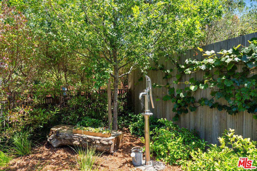 929 Marco Place Venice, CA 90291 - Photo 12 of 56 a backyard of a house with lots of green space and garden