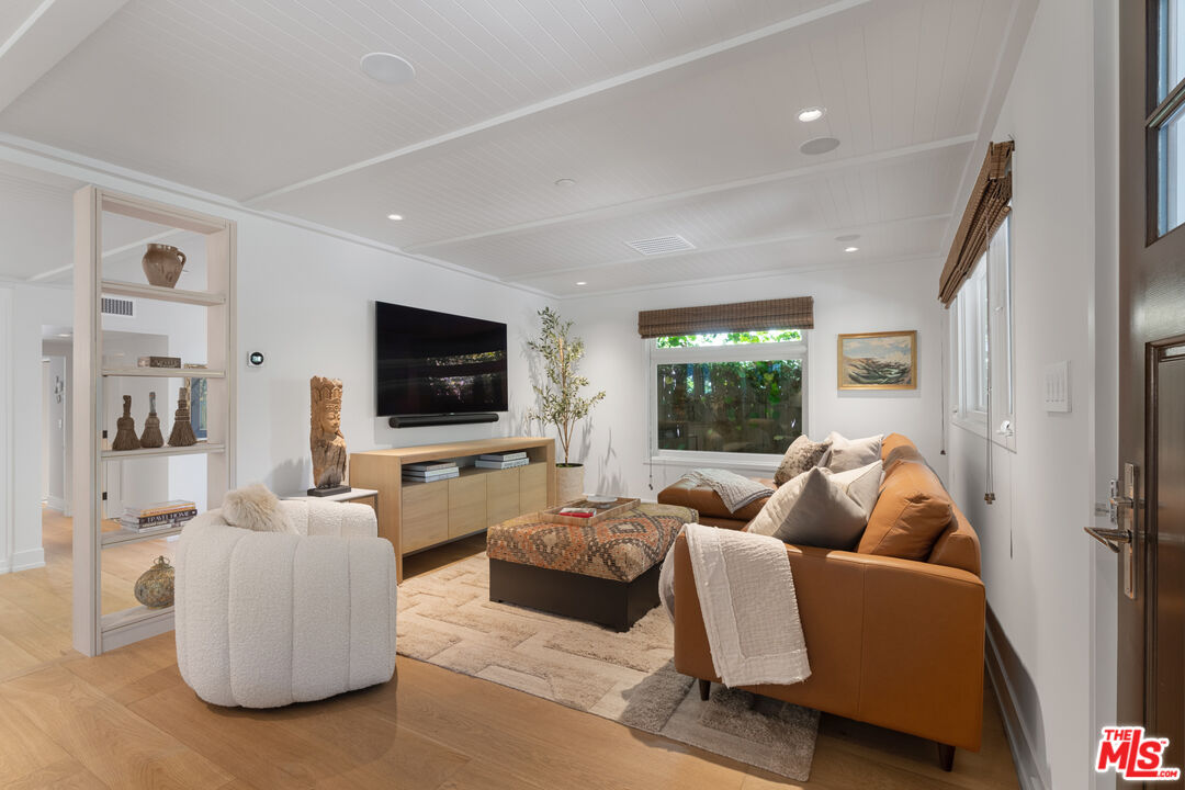 929 Marco Place Venice, CA 90291 - Photo 15 of 56 a living room with furniture and a flat screen tv
