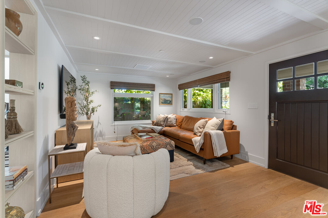 929 Marco Place Venice, CA 90291 - Photo 16 of 56 a living room with furniture and large windows